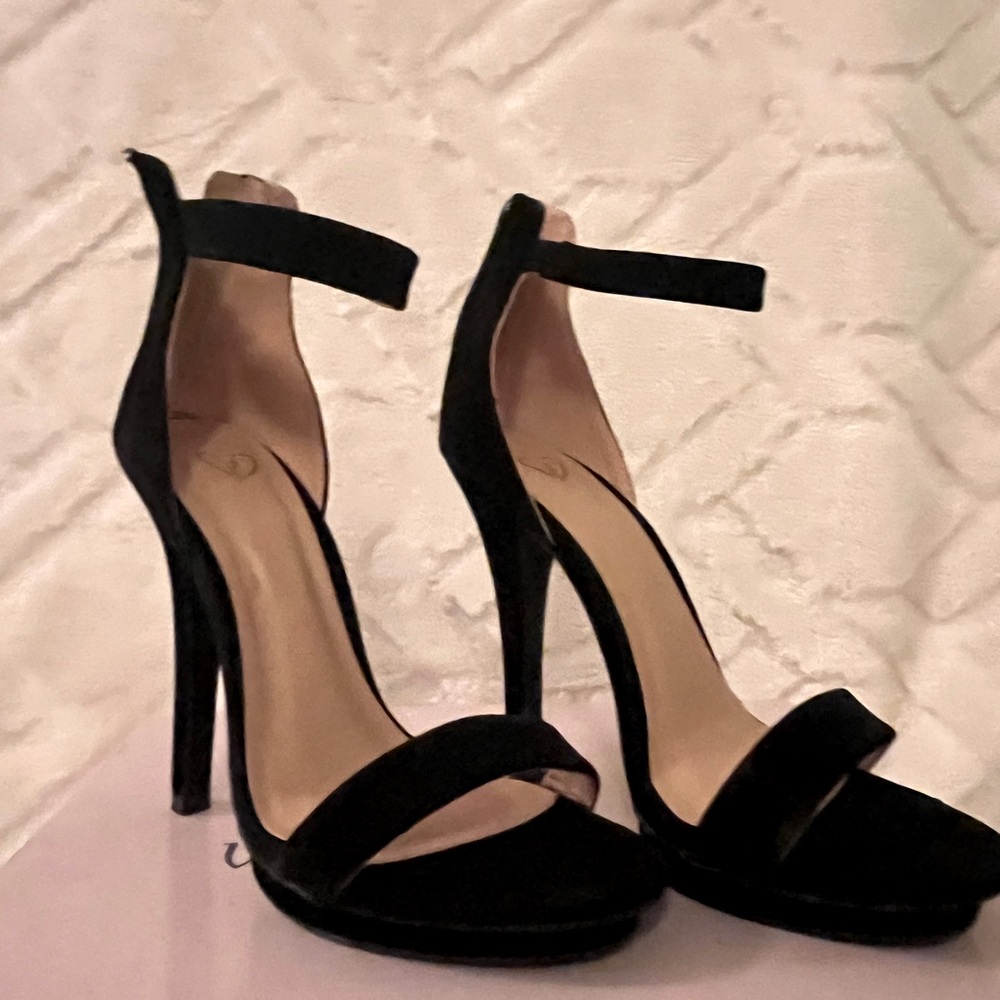Sexy black heels.  Never worn. Size 7